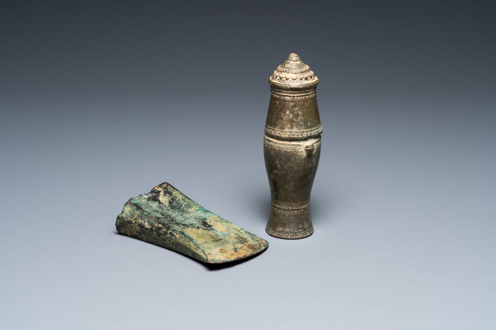 A Vietnamese bronze axe head, Dong Son, 3rd/1st C. BC and a small lime jar, L&ecirc; Dynasty, 15th C.