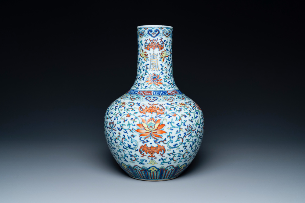 A Chinese doucai 'lotus scroll' bottle vase, Qianlong mark, 18/19th C.