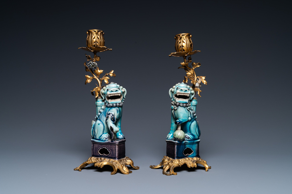 A pair of Chinese turquoise- and aubergine-glazed Buddhist lions with gilt bronze candelabra mounts, Kangxi and 19th C.