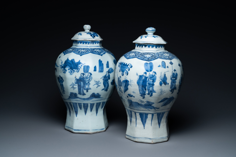 A pair of Chinese blue and white vases and covers with narrative design, Transitional period