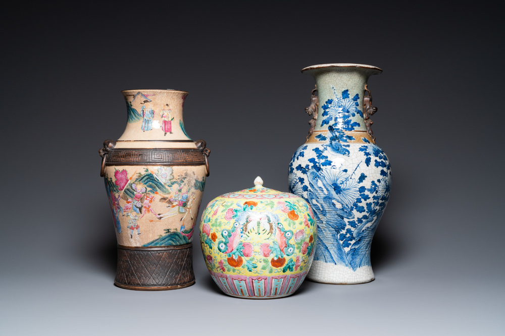 Two Chinese Nanking crackle-glazed vases and a yellow-ground famille rose 'butterflies' jar and cover, 19th C.