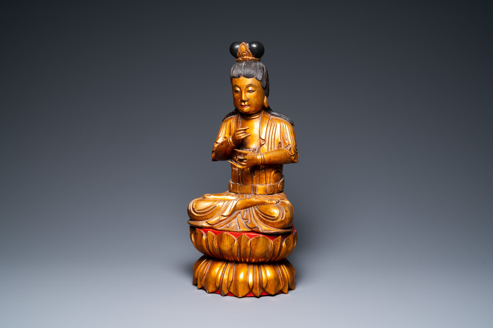 A large Vietnamese or Japanese gilded and lacquered wooden Buddha on lotus throne, 19th C.