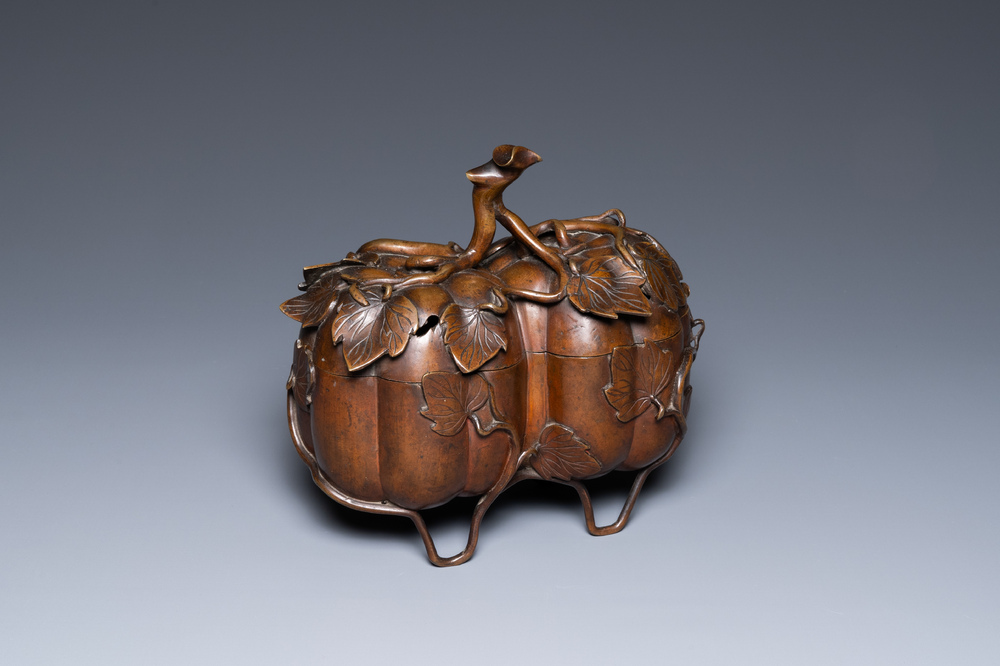 A Chinese bronze censer and cover in the shape of two pumpkins, 19th C.