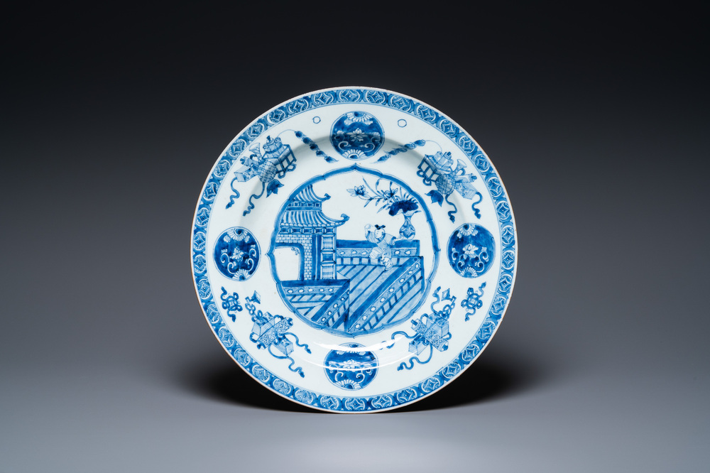 A Chinese blue and white dish with a boy on a terrace, Kangxi