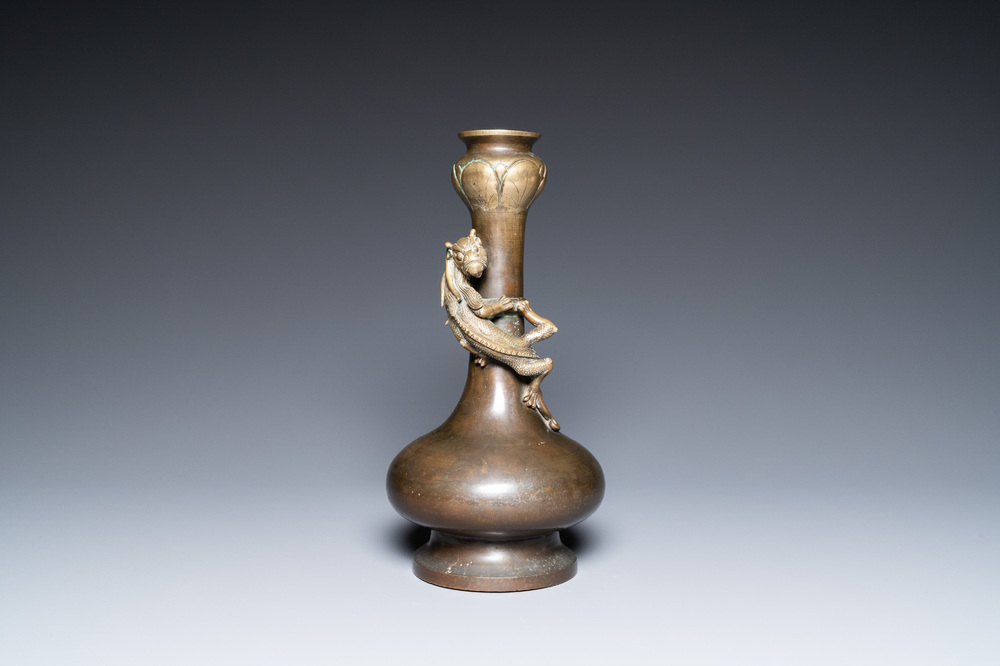 A Chinese bronze garlic-head 'hu' vase, Qianlong mark and of the period