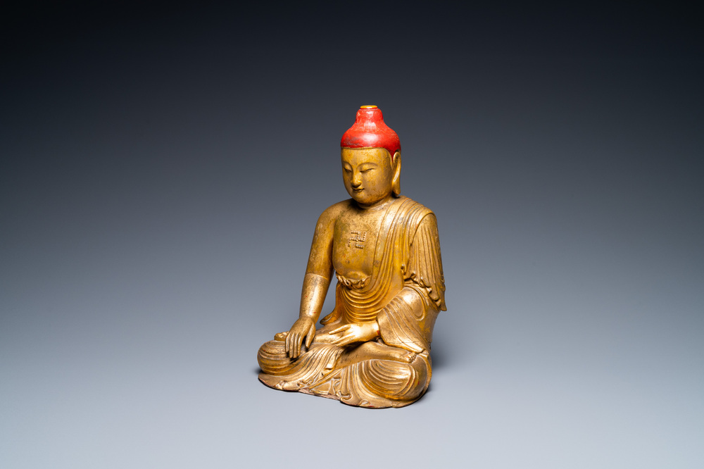 A Vietnamese or Japanese gilded and lacquered wooden Buddha, 19th C.