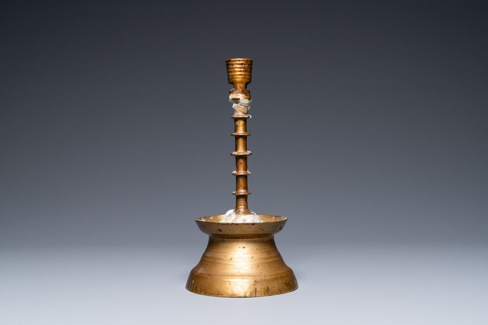 A Flemish or Dutch knotted bronze candlestick, 15th C.