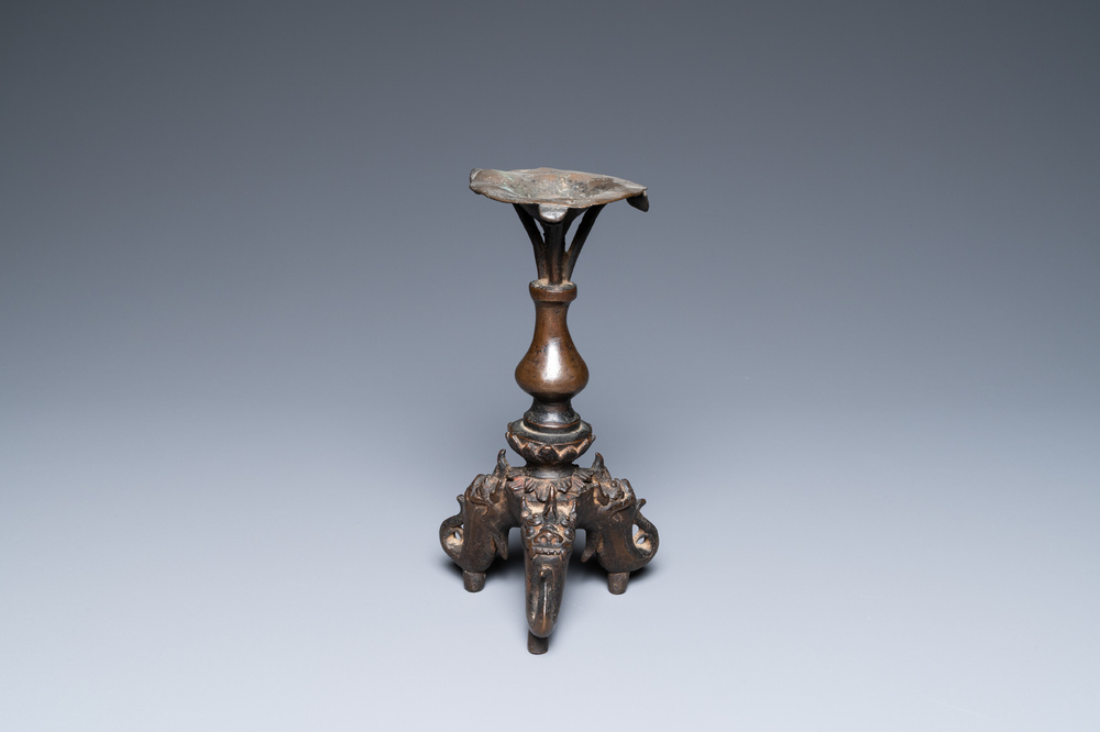 A Chinese bronze candlestick, Ming