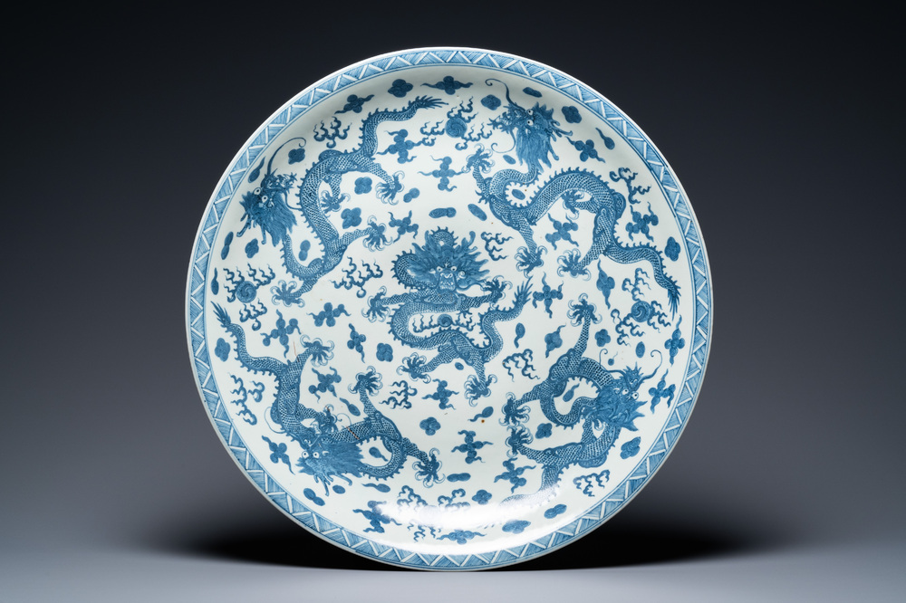 A massive Chinese blue and white 'dragon' dish, Kangxi mark, 19th C.