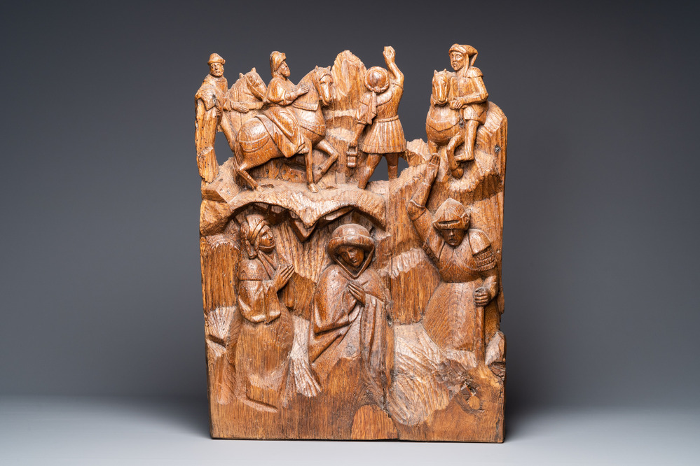 A Flemish carved oak retable fragment: 'Roman soldiers on mount Golgotha', ca. 1500