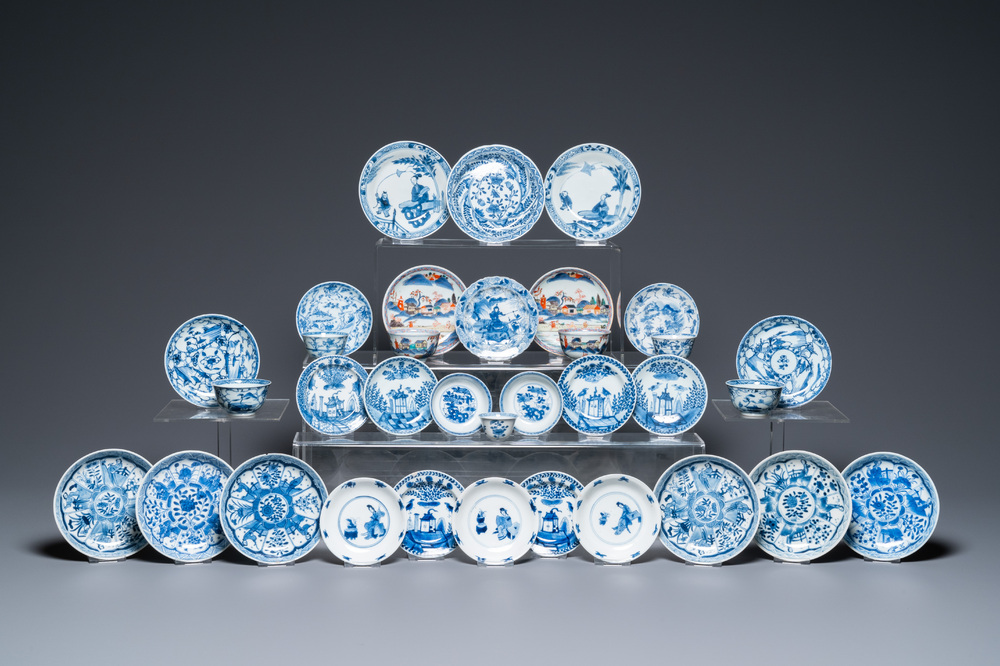 Twenty-seven Chinese blue and white saucers and seven cups, Kangxi and later
