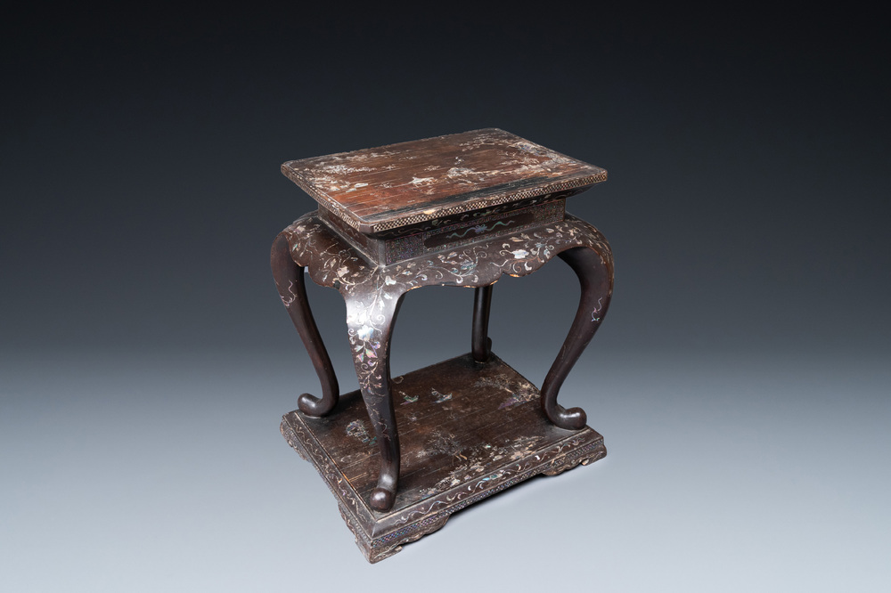 A Chinese mother-of-pearl-inlaid lacquered wooden stand, Kangxi