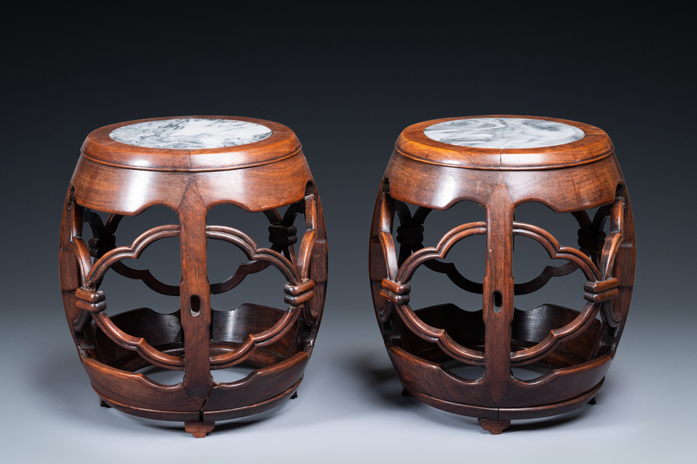 A pair of Chinese reticulated hongmu wooden stands with marble 'dreamstone' plaques, 19th C.