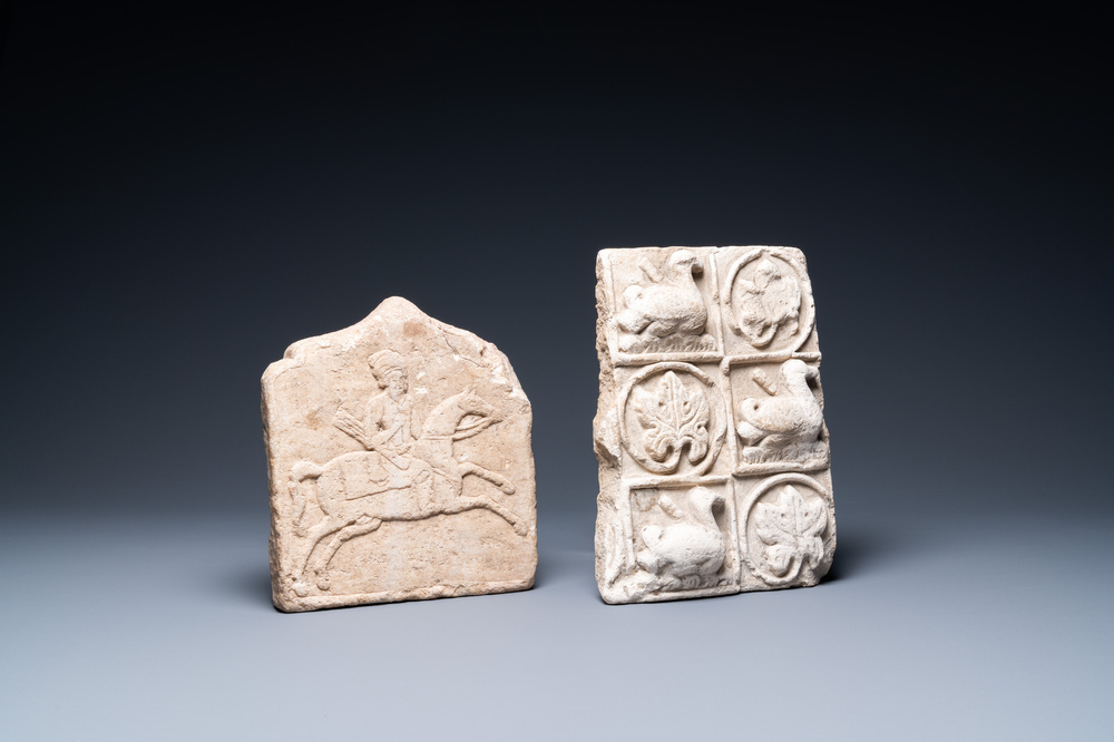 A marble 'horserider' tile fragment and a sandstone fragment with birds and floral vines, Persia, 13th C. and/or later