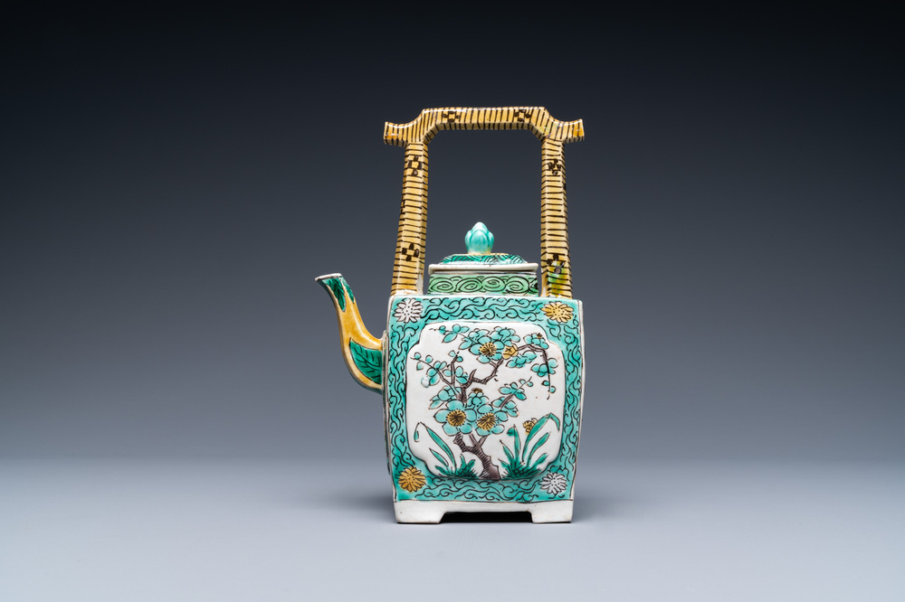 A Chinese verte biscuit teapot and cover, Kangxi