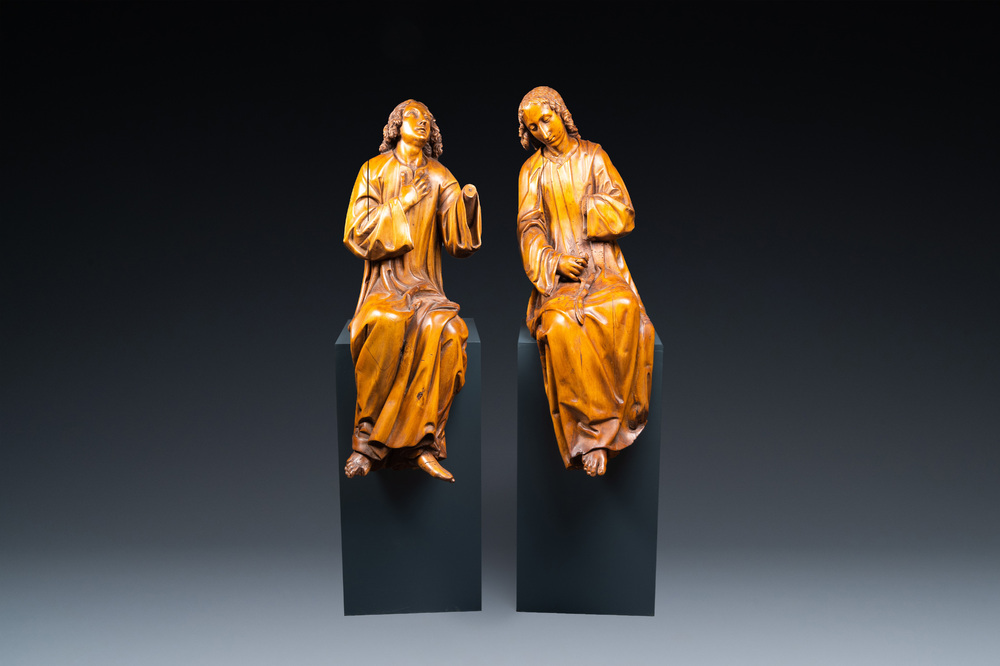Two impressive Flemish carved oak figures of seated angels, 17th C.