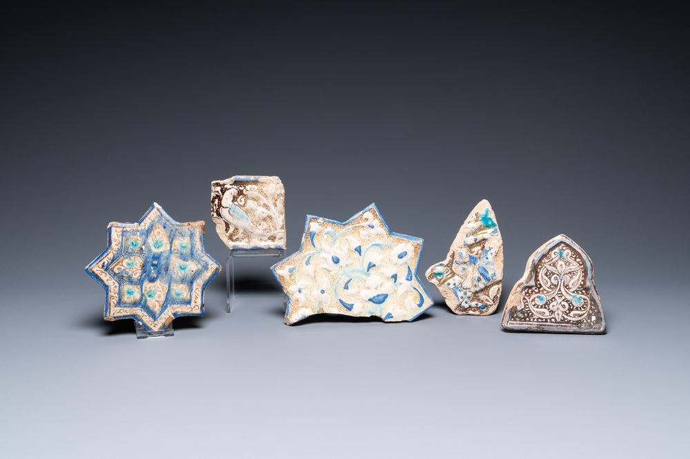 A Kashan star tile and four fragments of luster-glazed tiles, Iran, 13/16th C.