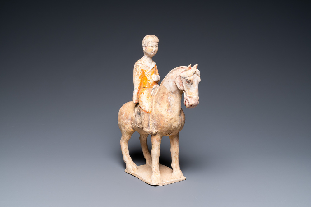 A Chinese painted pottery 'lady on horseback' group, Tang