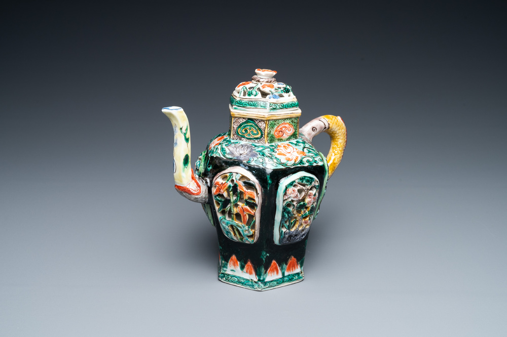 A Chinese verte biscuit reticulated teapot and cover, Kangxi