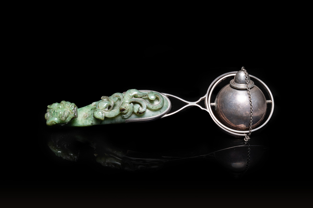 A Chinese jade belt buckle mounted as a table lighter in silver by Gump &amp; Co, Qing and 20th C.