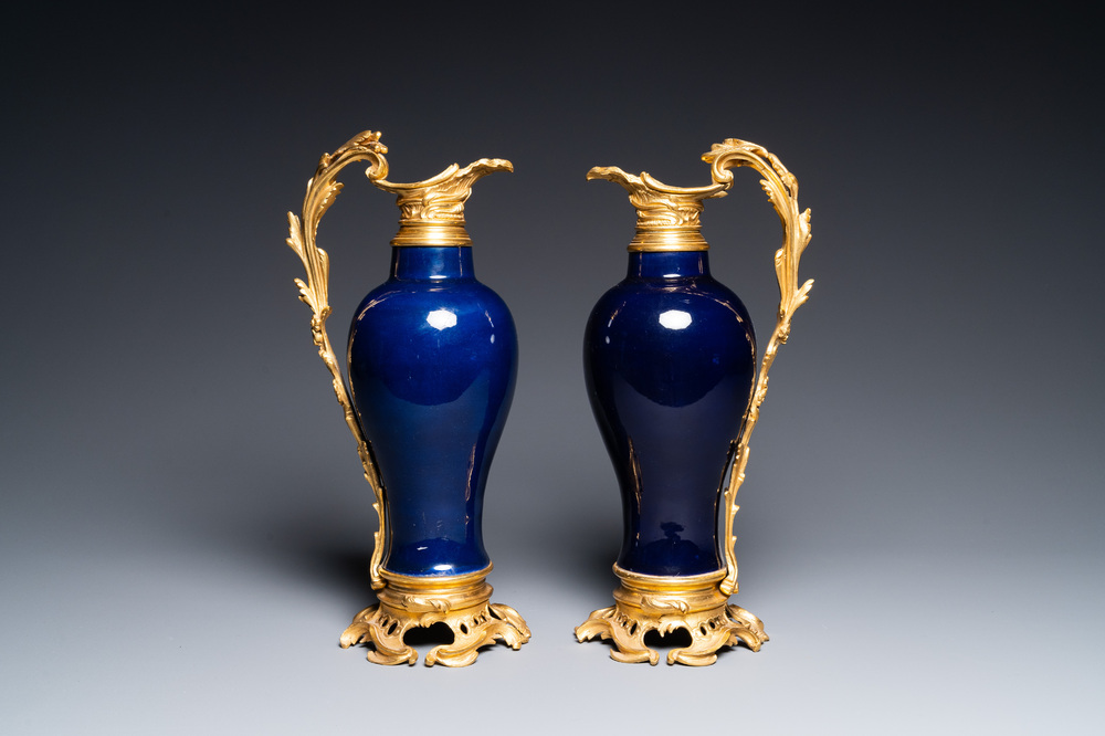 A pair of Chinese monochrome blue vases with gilt bronze ewer mounts, Qianlong and 19th C.