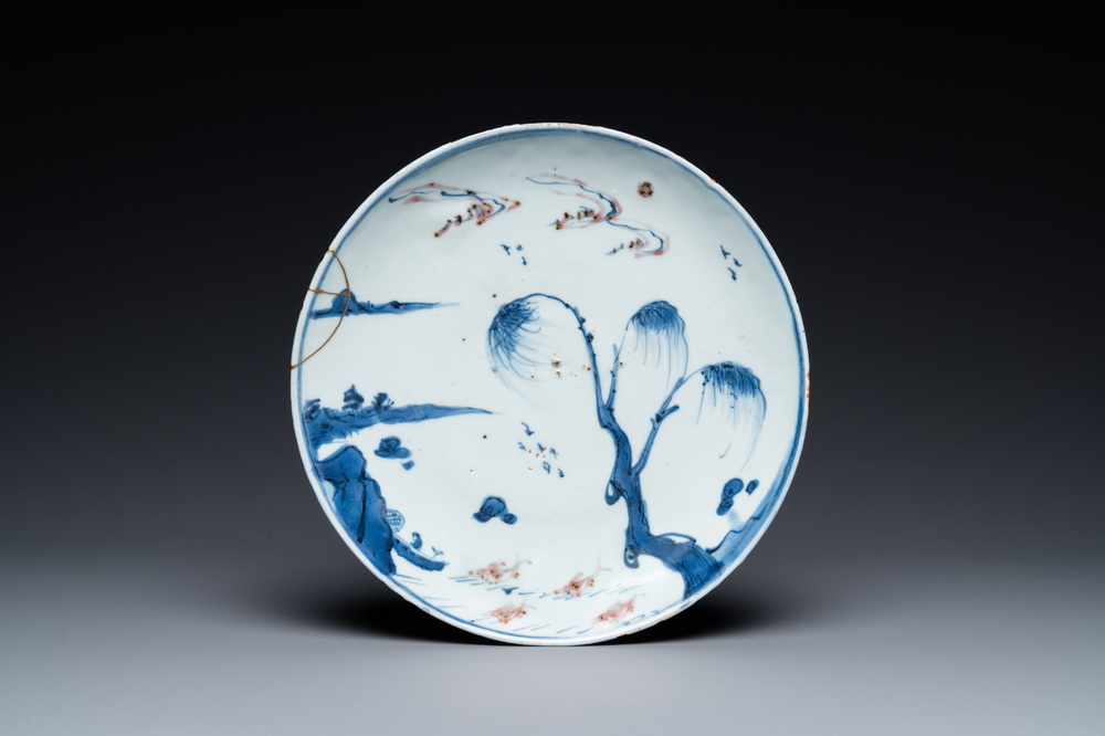 A Chinese blue, white and copper red ko-sometsuke 'fish' plate for the Japanese market, Transitional period