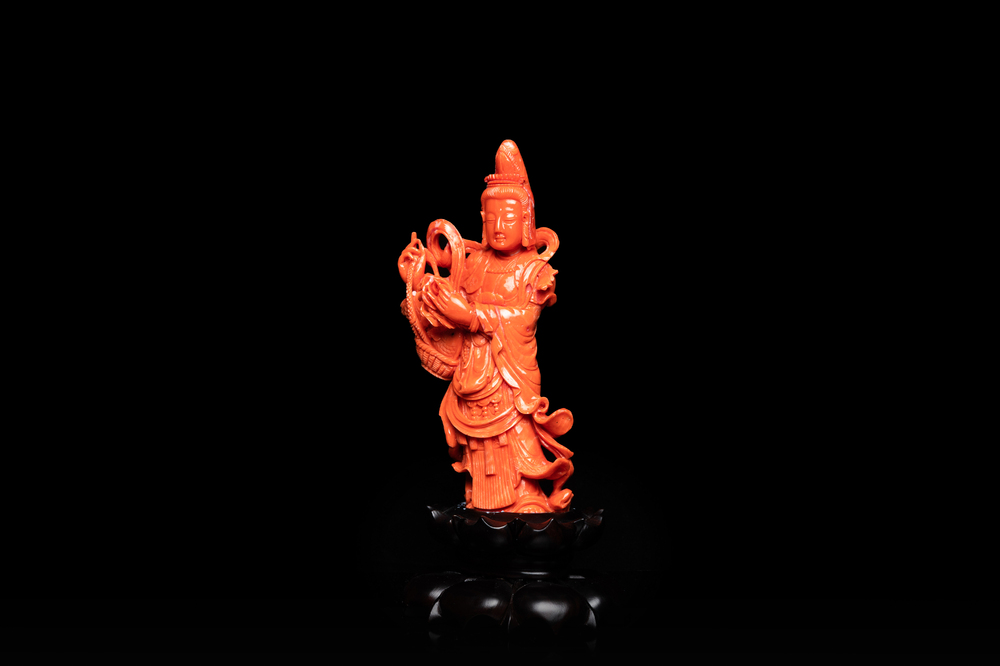 A Chinese carved red coral 'Tara' figure, 19/20th C.