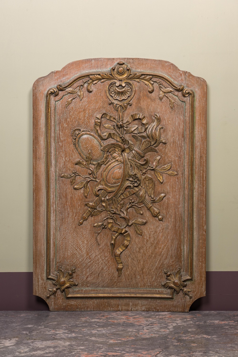 A French carved wooden 'Style Transition' panel with ribbons and acanthus leaves, 18th C.