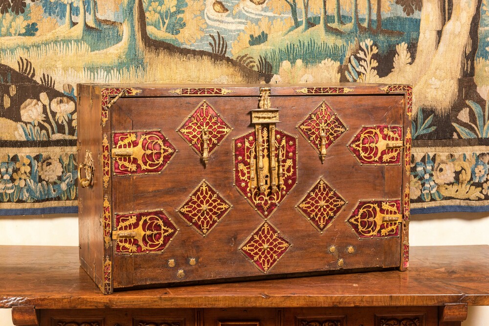 A Spanish walnut 'bargue&ntilde;o' cabinet with red velvet and bronze mounts, 17th C.