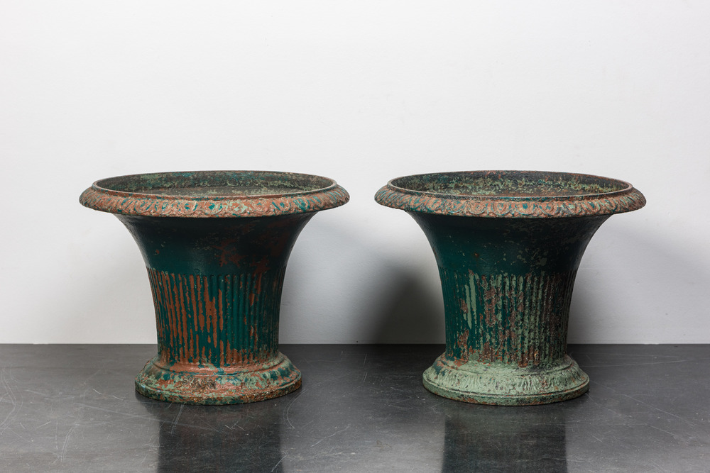 A pair of green-painted cast iron jardini&egrave;res, 19th C.