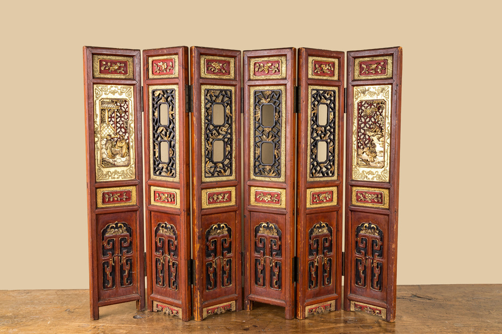 A Chinese six-panel screen in painted, gilt and reticulated wood, 19th C.