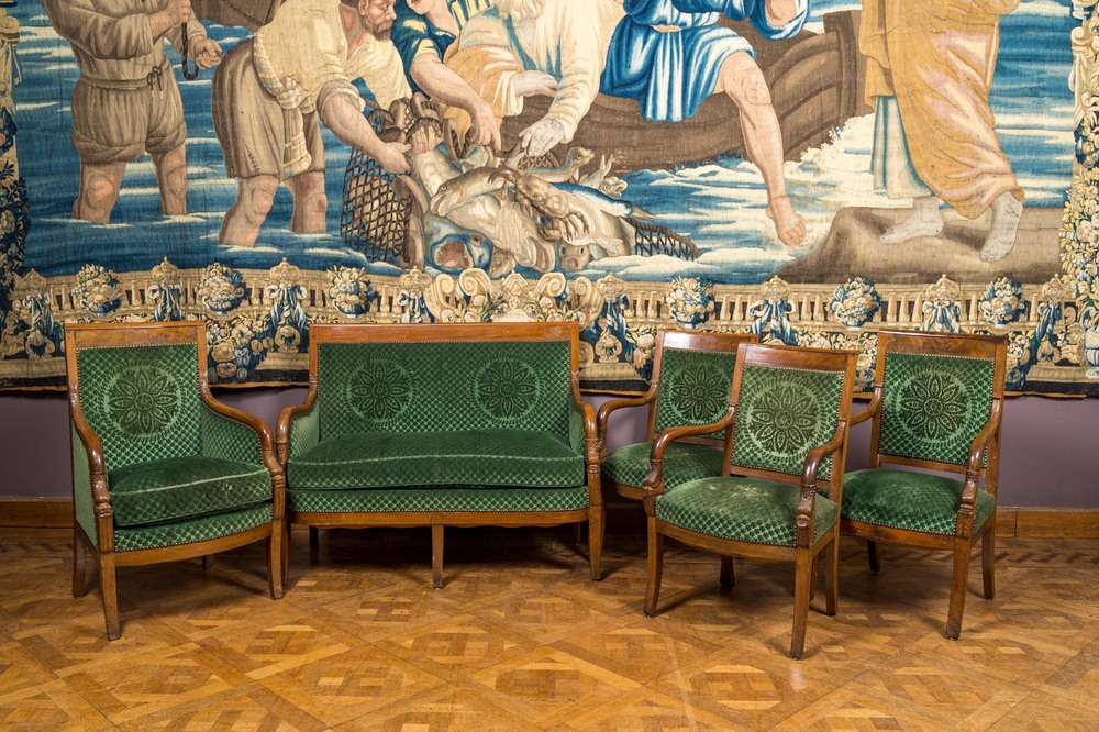 A green-upholstered carved wooden salon set with a two-seater, a fauteuil and three armchairs, 19th C.