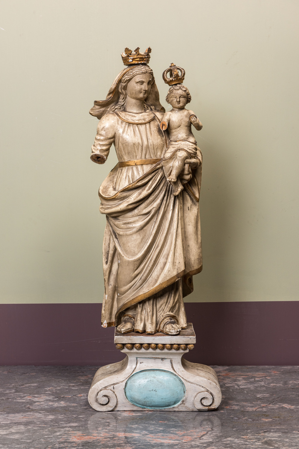 A polychromed wooden Madonna and Child on stand, 17/18th C.