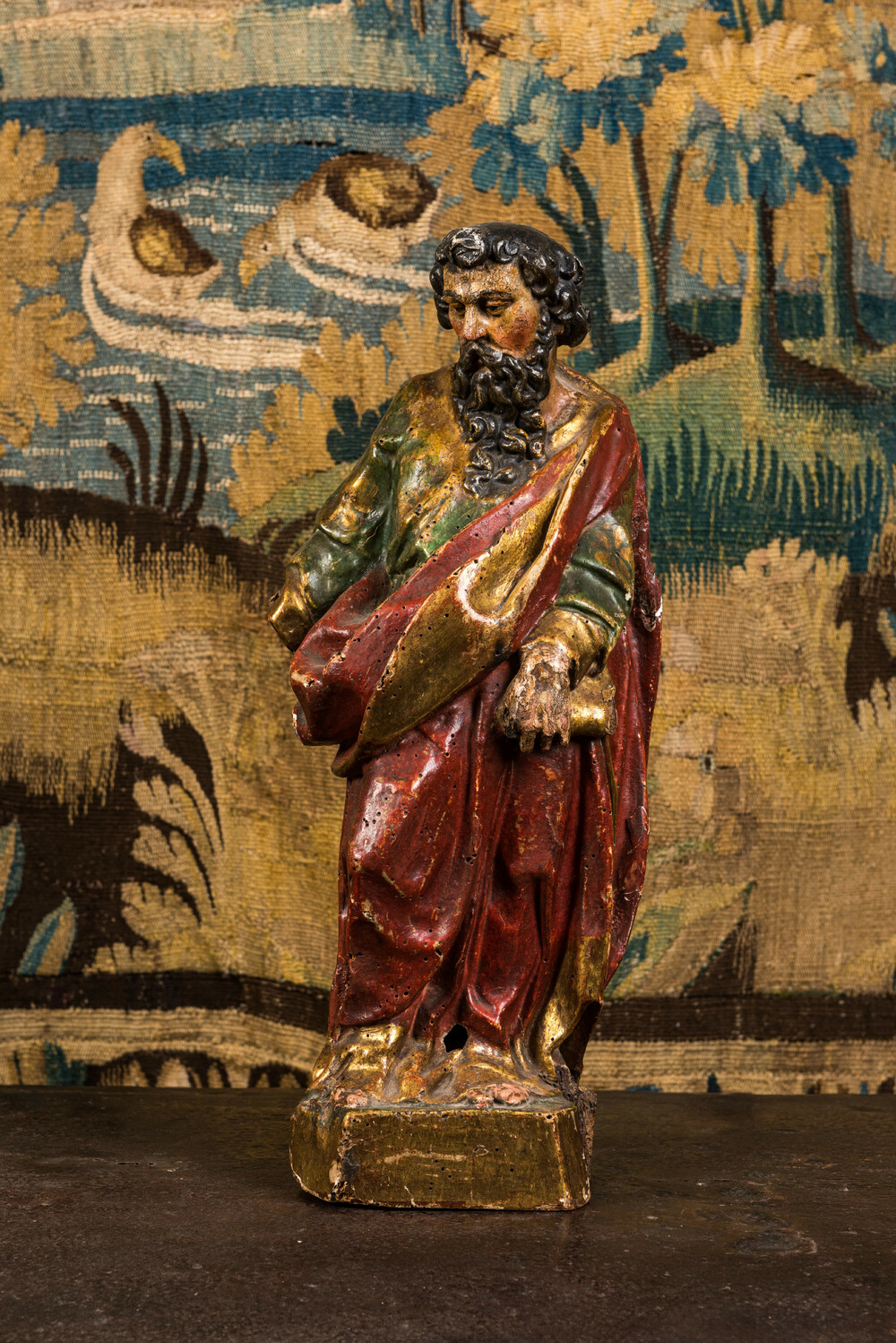 A polychrome wooden sculpture of a saint, 17th C.