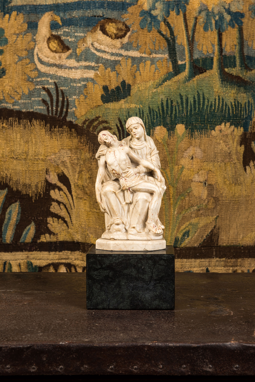 An alabaster Piet&agrave; with polychrome design, 17th C.