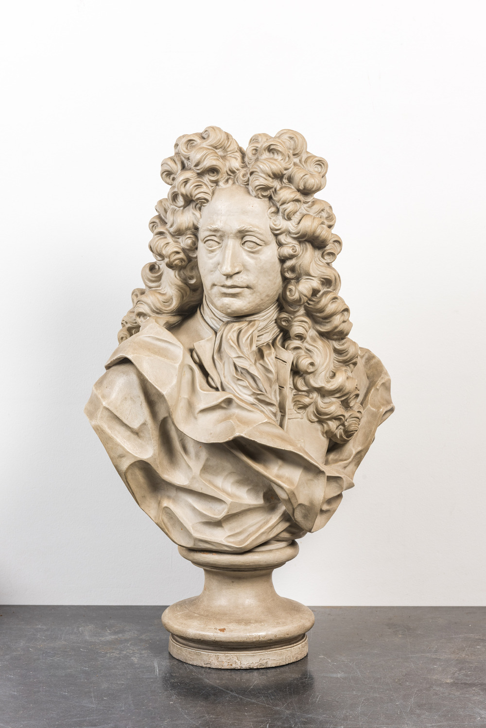A French white-patinated terracotta bust of a nobleman in the style of Pierre-Fran&ccedil;ois Berruer (1733-1797), 19th C.