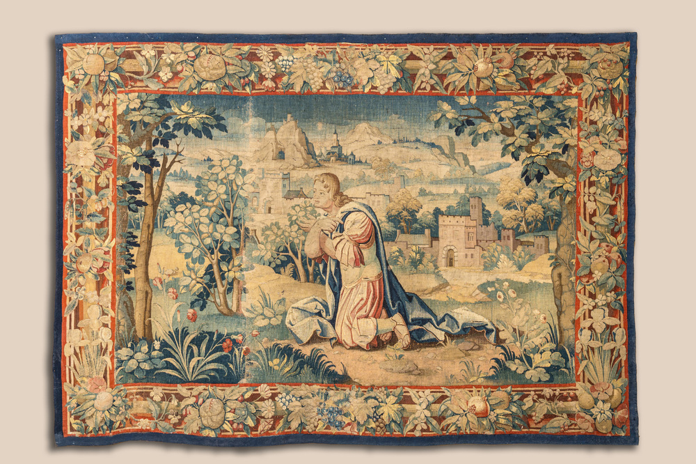 A Flemish wall tapestry with a kneeling apostle, 17th C.