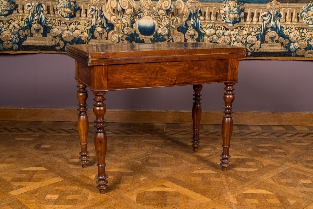 A wooden gaming table with red inner lining, 19th C.