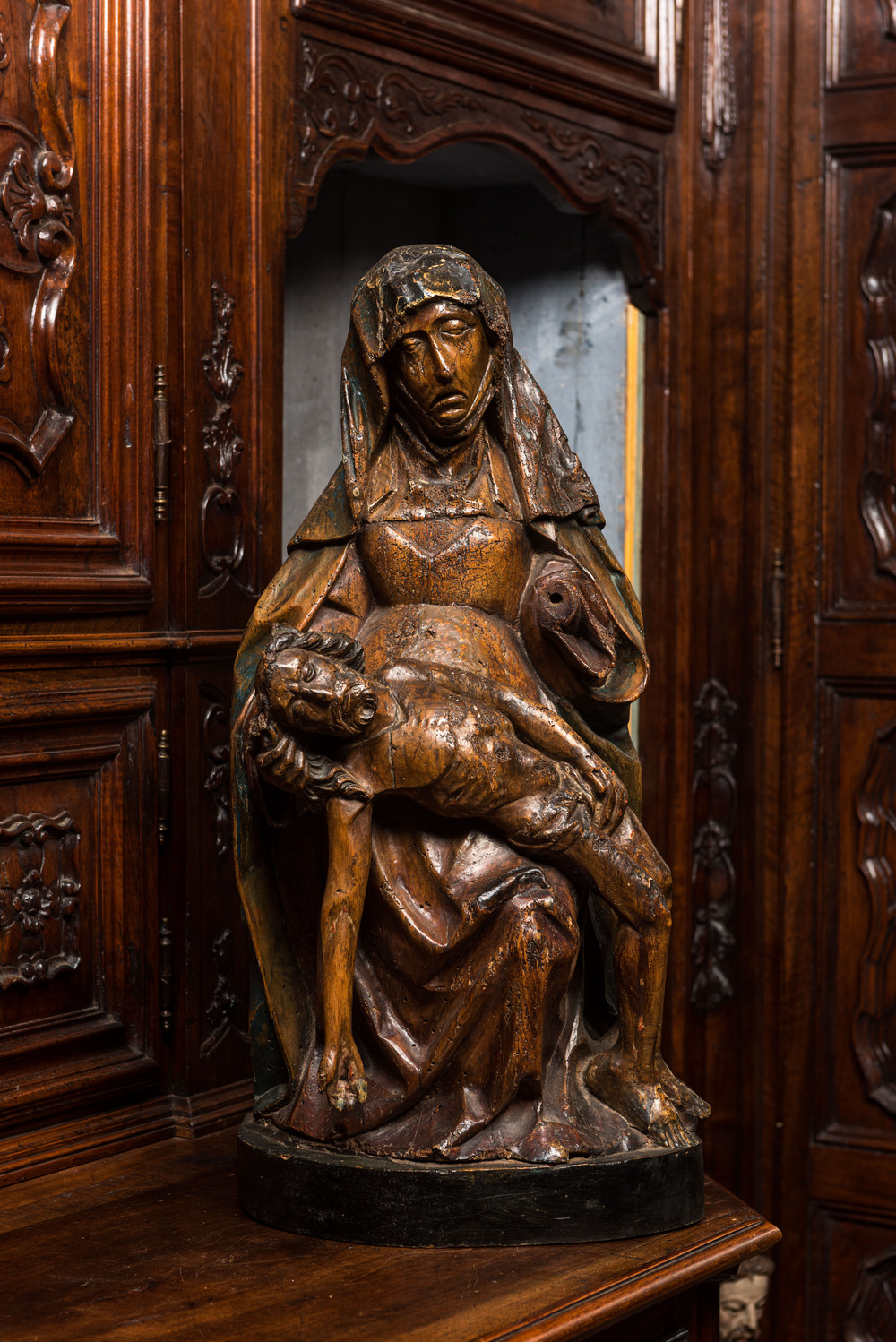 A large walnut Piet&agrave; with traces of polychromy, Southern Netherlands, 1st half 16th C.