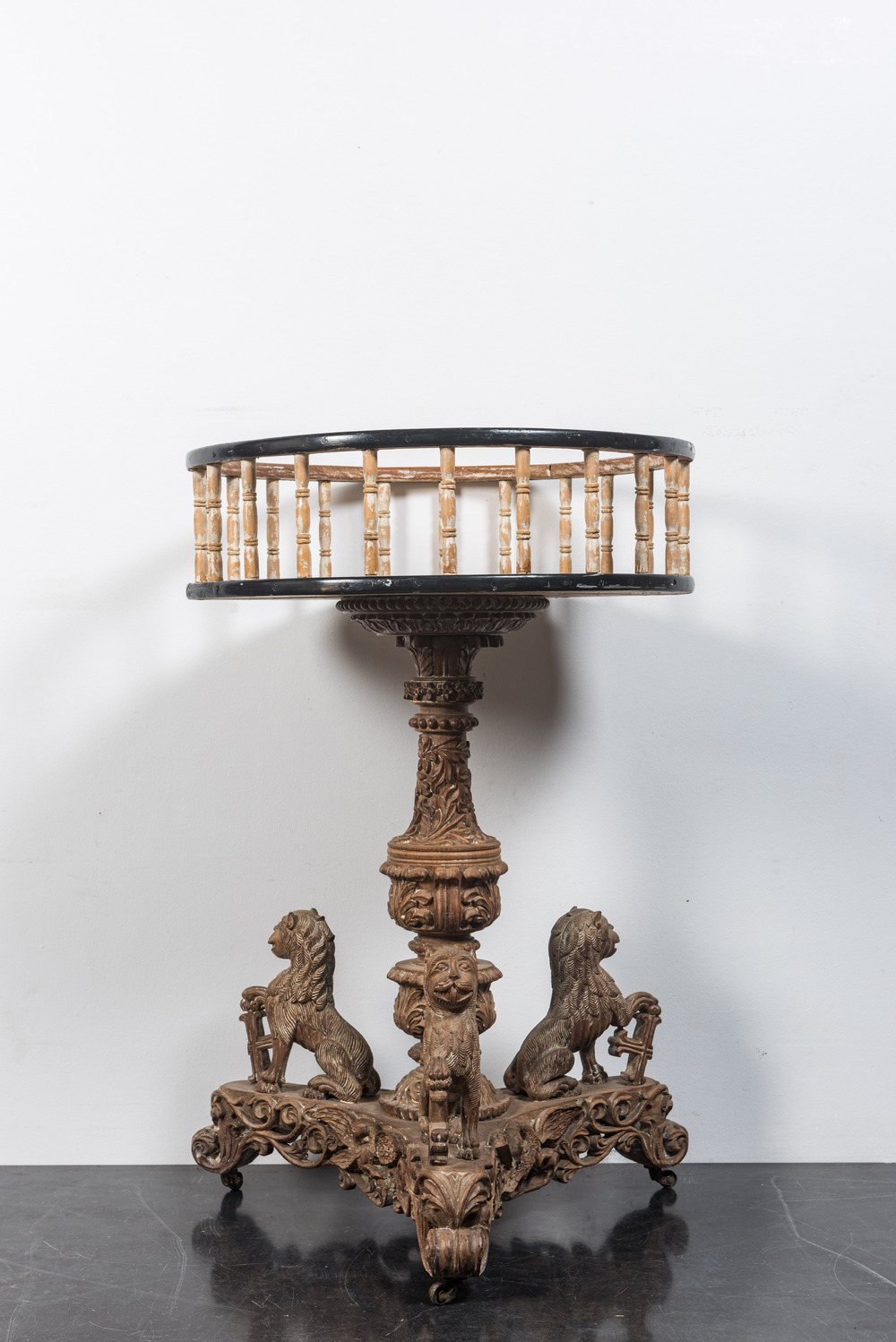 A large patinated wooden tripod jardini&egrave;re, 19th C.