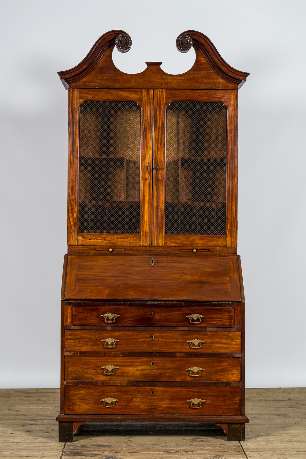 An English mahogany bookcase over secretary desk, 18th C.