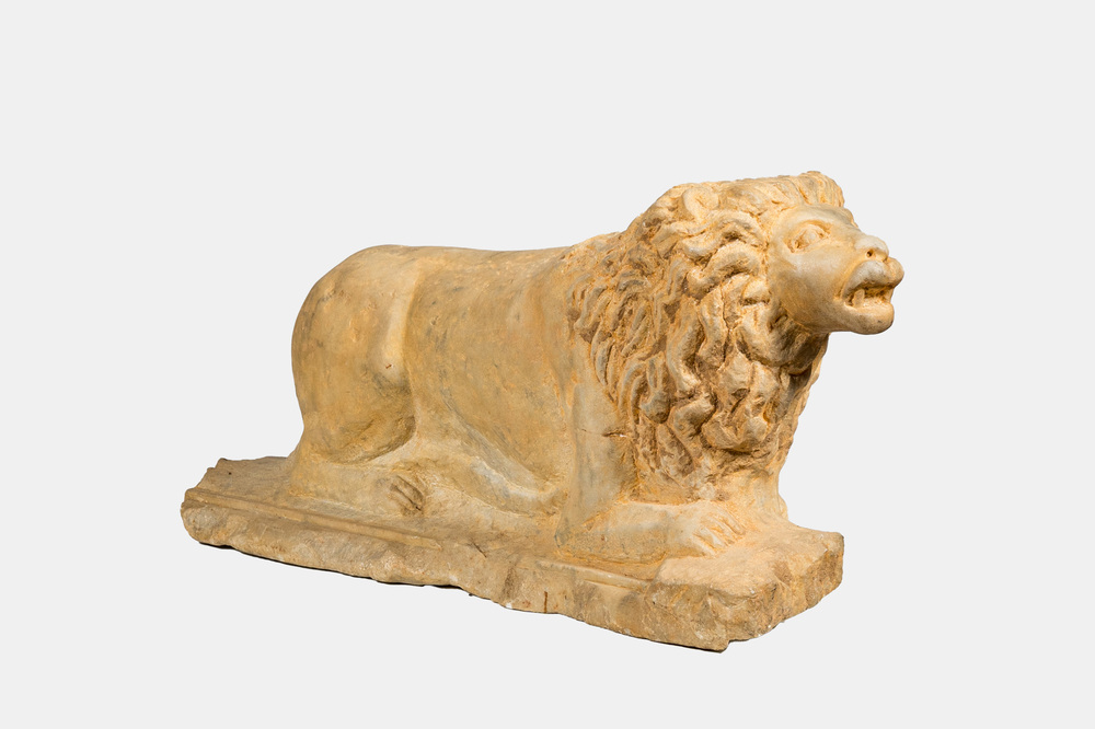 A marble model of a reclining lion, 20th C.