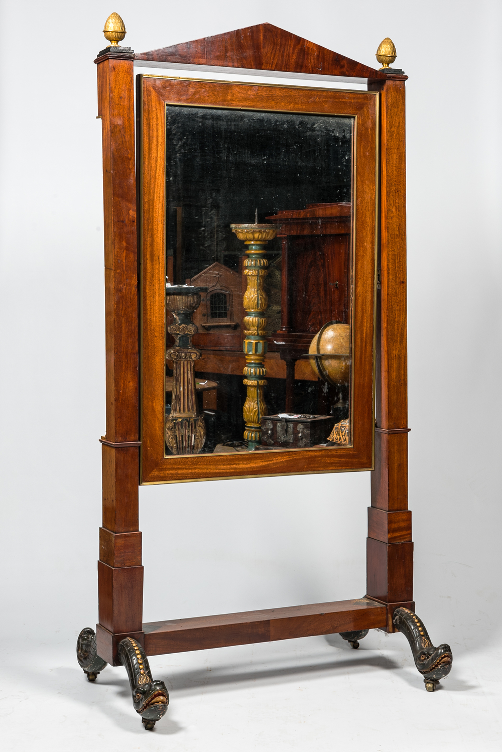 A large French mahogany Empire psych&eacute; or cheval dressing mirror, 19th C.