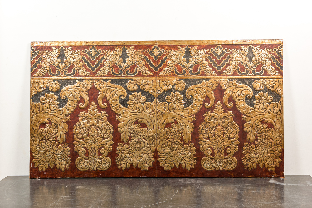 A Spanish rectangular panel of embossed gilt leather wallpaper, signed Meryan, Cordoba, 20th C.