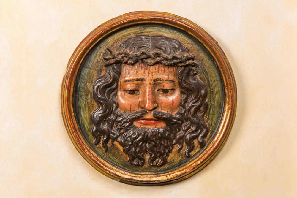 A polychrome wooden 'Christ with the crown of thorns' medallion, probably 17th C.