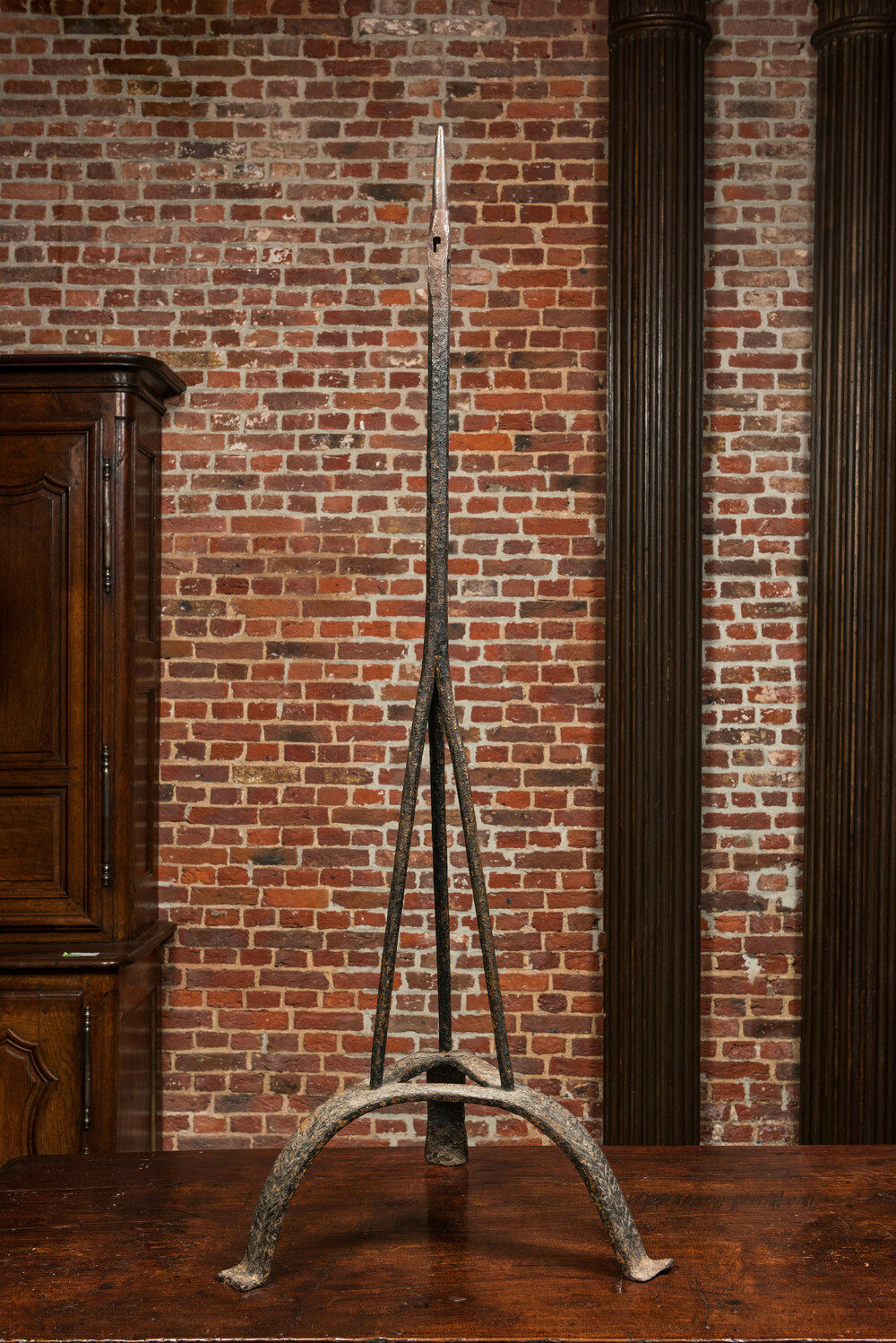 A large wrought iron pricket candlestick, probably 15/16th C.
