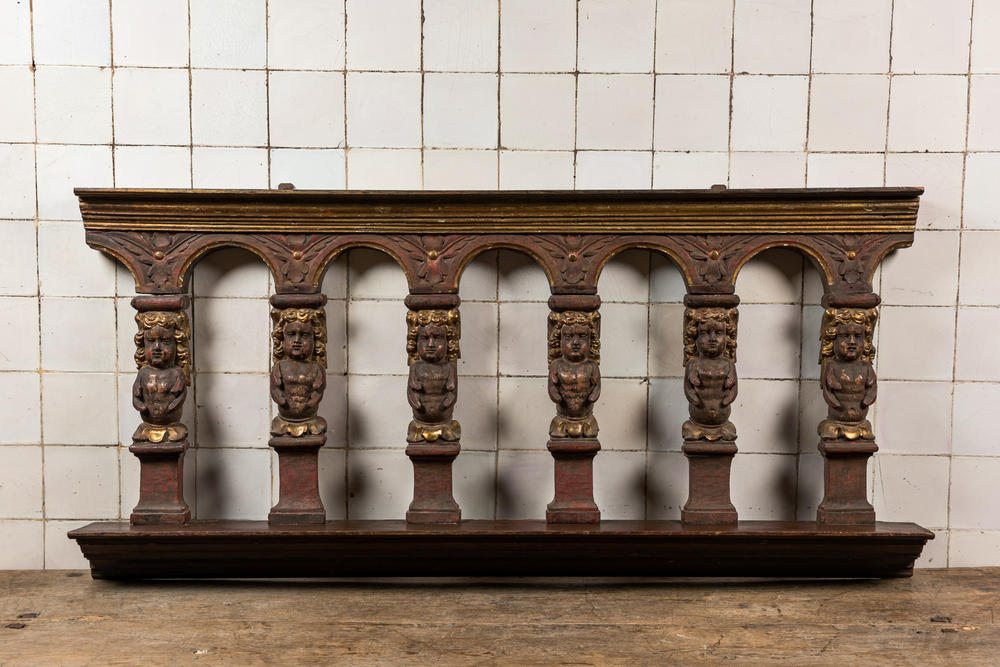 A polychrome and gilt walnut cherubim choir balustrade, probably 17th C.