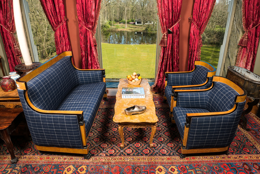 A root wood veneer and partly ebonised wooden salon with two armchairs and a sofa, 19/20th C.