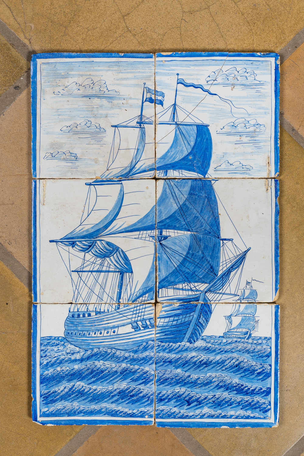 A six-piece Dutch Delft blue and white tile mural with a two-master, 19th C.