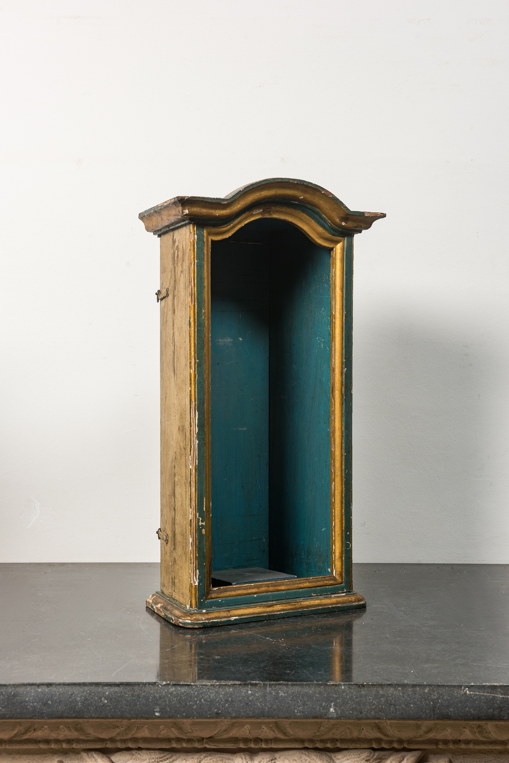 A polychromed and partly gilt wooden hanging niche, 18th C.